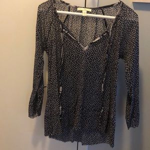 Gray and white polka dotted blouse